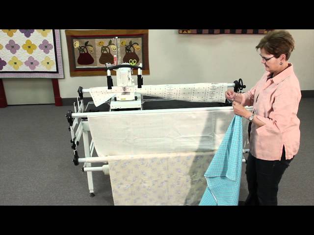 attaching fabric to a metal Grace Quilting Frame