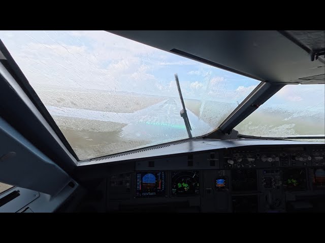 Unexpected Thunderstorms heavy rain Amsterdam approach A320neo | go around or continue? 