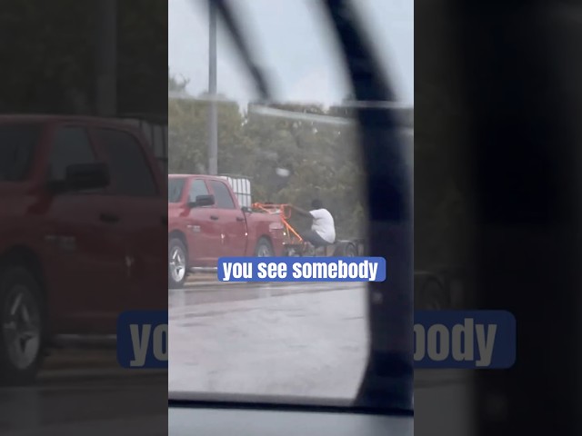 Man Rides Trailer Holding a Refrigerator in a Rainstorm 😳🚚