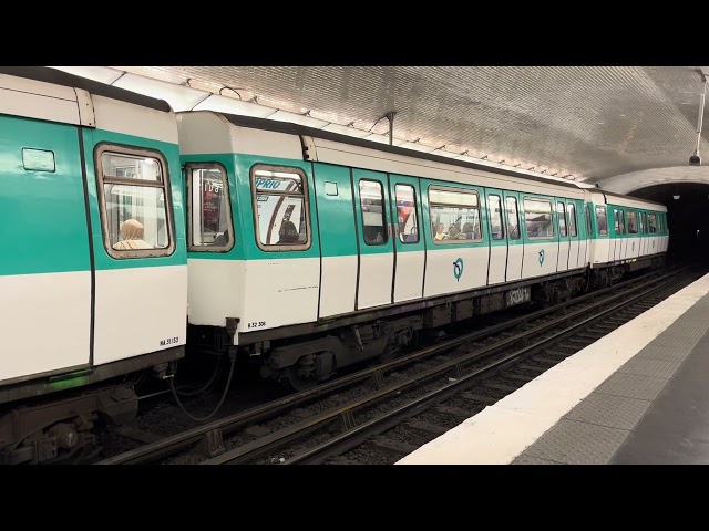 Paris Metro (line 13) MF77 arrives and departs from Garibaldi